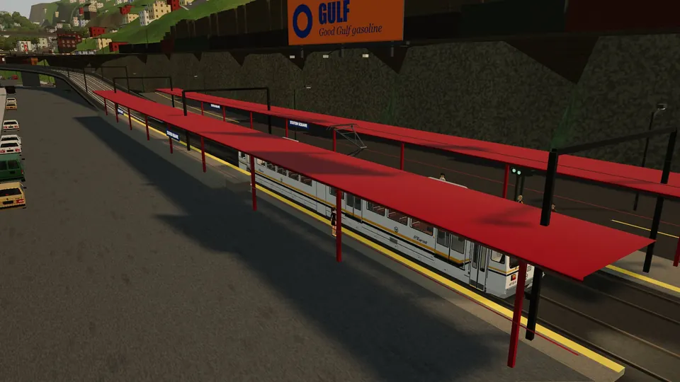 An SD-400 under the red canopies of Station Square with the Gulf sign on the hillside above